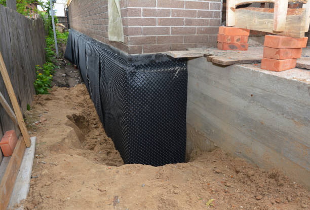 SJ Waterproofing Pros technician performing targeted Waterproofing assessment in Woodstock, VA